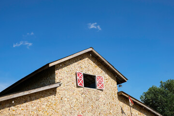 Building with stone exterior against blue sky