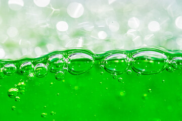 Water wave, close up of vibrant green liquid with bubbles, capturing dynamic movement and...