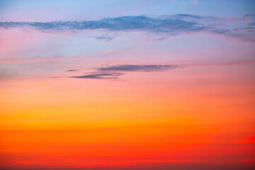 Sky,Beautiful sunset view, luxury soft gradient orange gold clouds and sunlight on the blue dramatic sky perfect for the background, morning, evening,Twilight, climate change,horizontal sunset photo
