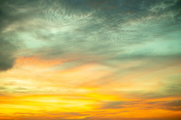 Sky,Beautiful sunset view, luxury soft gradient orange gold clouds and sunlight on the blue dramatic sky perfect for the background, morning, evening,Twilight, climate change,horizontal sunset photo