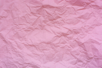 Close-up of pink crumpled paper backdrop,Texture of pink crumpled paper for background.