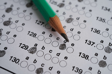 Answer sheets with pencil drawing fill to select choice, education concept.