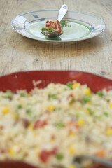 Fresh Vegetable Salad with Rice in a Red Bowl