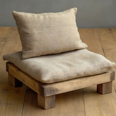 Two Burlap Pillows Rest Gently Upon A Wooden Stool
