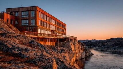 Fototapeta premium Hotel di lusso su scogliera a tramonto