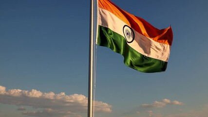 Indian national flag waving against blue sky with clouds  