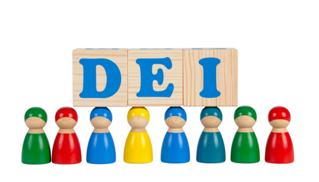 Colorful wooden figures stand beneath wooden blocks displaying the letters DEI.