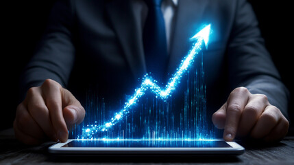 Professional businessman using digital tablet and laptop, analyzing business growth chart with upward arrow