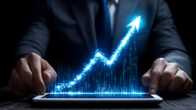 Professional businessman using digital tablet and laptop, analyzing business growth chart with upward arrow