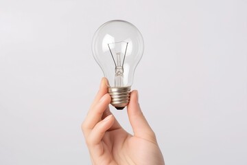 hand holding glowing light bulb isolated on white background