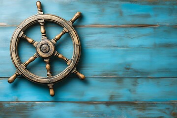 Obraz premium Vintage Wooden Ship Steering Wheel on Rustic Blue Background: Nautical Symbol of Adventure and Maritime Heritage