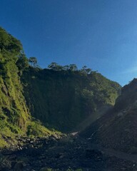 Majestic Green Mountain Range Under Clear Sky