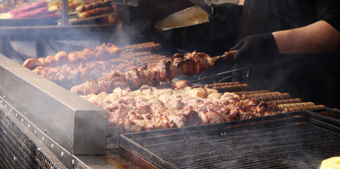 Shashlik on skewers is cooked on a grill over coals. Tasty and juicy meat. Marinated shashlik is...