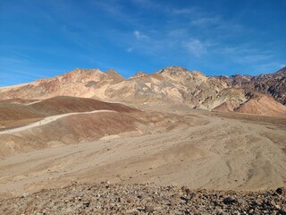 Volcanic minerals such as iron oxides give many colors on this barren slopes of the Black Mountains