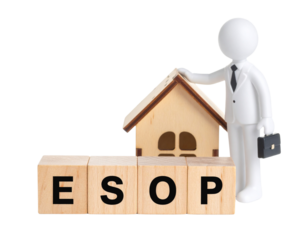 A figure in a suit holding a briefcase stands beside a wooden house and ESOP letter blocks.