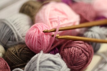 Different colors clews yarn balls and crochet hooks handmade decor photo  