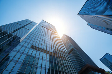 The glass exterior wall of the skyscraper in the financial center