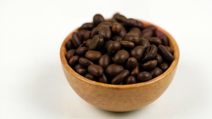 Fototapeta premium Simple coffee beans in a wooden bowl on white background. Useful for illustrating food, beverage, or cafe concepts in isolated settings.