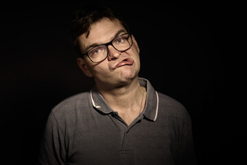 Photographer man in glasses and shirt with doing expressions