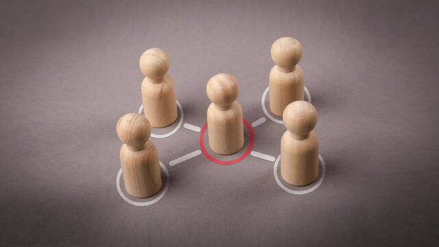 Intermediary between groups Political negotiations. Wooden Figures on a Gary background