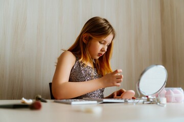 A 13-year-old teenage girl is applying makeup and taking care of her skin in front of a mirror. She enjoys experimenting with beauty products, learning self-care, and developing her personal style