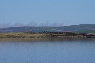 The Ring of Brodgar 5000 year Old Neolithic Henge and Stone Circle on Mainland Orkney across the Loch of Harray, Scotland, UK	