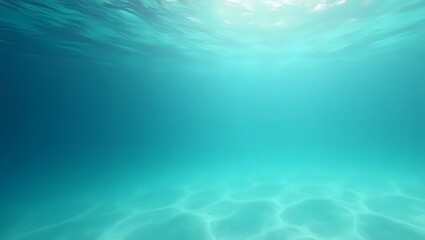 Tranquil underwater scene depicting sunlight rays and sandy ocean floor surface