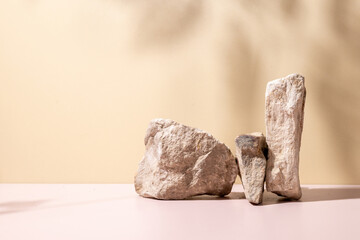 A refined stone podium set against a beige backdrop, enhanced with soft natural shadows—perfect...