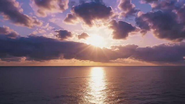 Golden clouds reflecting on ocean surface