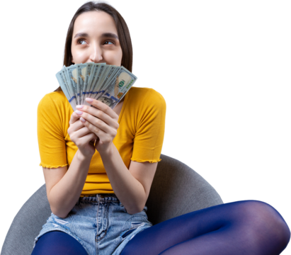 Photo of a wealthy woman in simple clothes holding a fan of dollar money isolated against a concrete wall background