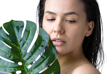 Beauty Woman with natural green palm leaf portrait. Fashion, beauty, make-up, cosmetics.