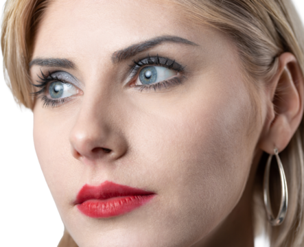 Portrait of a seductive, stylish business lady in the studio. Blonde girl in a suit and top.