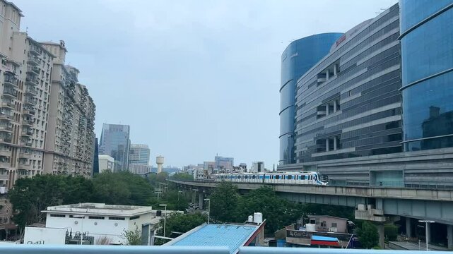 Drone Shot of DLF Cyber City Gurgaon &ndash; Aerial View of Iconic IT Hub with Glass Towers, Office Buildings, Skywalk, Metro Line, and Modern Infrastructure in Gurugram, India