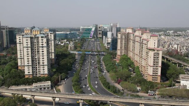 Drone Shot of DLF Cyber City Gurgaon &ndash; Aerial View of Iconic IT Hub with Glass Towers, Office Buildings, Skywalk, Metro Line, and Modern Infrastructure in Gurugram, India