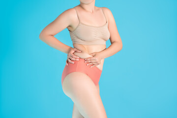 Tummy tuck, flabby skin on a fat belly, plastic surgery concept