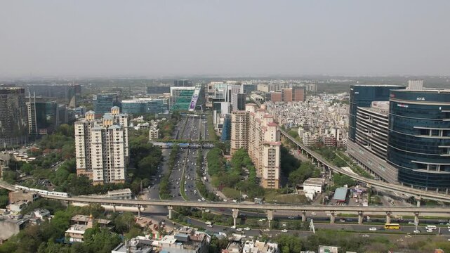 Drone Shot of DLF Cyber City Gurgaon &ndash; Aerial View of Iconic IT Hub with Glass Towers, Office Buildings, Skywalk, Metro Line, and Modern Infrastructure in Gurugram, India