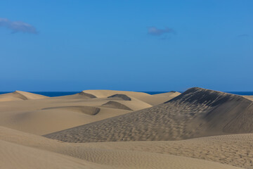 Desert landscape and sand dunes in Maspalomas. View of dunes and sea. Gran Canaria Island Spain