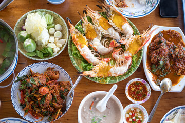 A variety of Thai seafood freshly served dishes in the restaurant. Directly above view