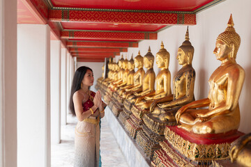 Beautiful woman in traditional dress costume,Asian woman wearing typical Thai dress identity culture of Thailand.