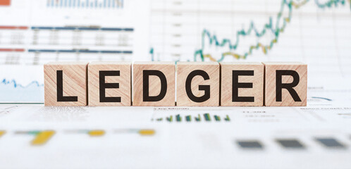 Wooden Blocks Spelling Ledger on Financial Charts