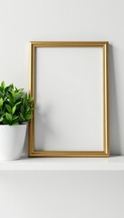 Elegant gold frame atop white shelf with vibrant plant, arrangement, house