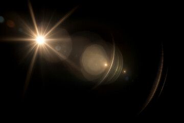 Vibrant, golden lens flare effect on a dark background, with light rays and halo circles. Ideal as an overlay or background to add glow, warmth and a cinematic touch to photography, video, graphic des