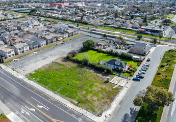 Aerial views of Central Avenue area showing open lots, residential housing, parking, and infrastructure near a major intersection and transit corridor.