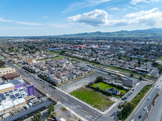 Aerial views of Central Avenue area showing open lots, residential housing, parking, and infrastructure near a major intersection and transit corridor.
