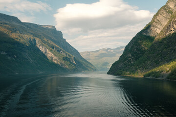 View of the entrance to the Geirangerfjord in Norway. With huge cliffs on the left and right.