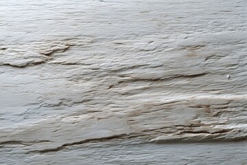 Weathered wood texture featuring cracks and a white washed appearance. The raw surface has a natural, aged character and neutral palette.