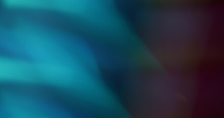 Defocused glare. Turquoise shade. Sparkling blue colored optical waves on blurred bokeh light modern abstract background.