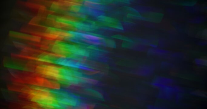 Rainbow glow. Blur light texture. Defocused colorful green blue red lens flare on abstract bokeh abstract background.
