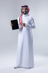 A collection of images of an Arab man wearing traditional Saudi thobe and shemagh, reflecting modern lifestyle activities like using technology, shopping, and standing confidently in a studio setting.