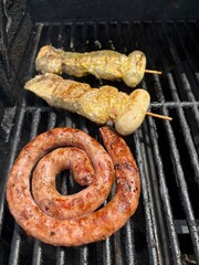 sausages and meat on grill